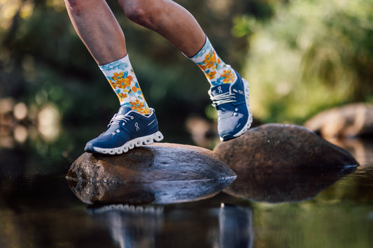 White crew sport socks with honey yellow bees and turquoise flowers